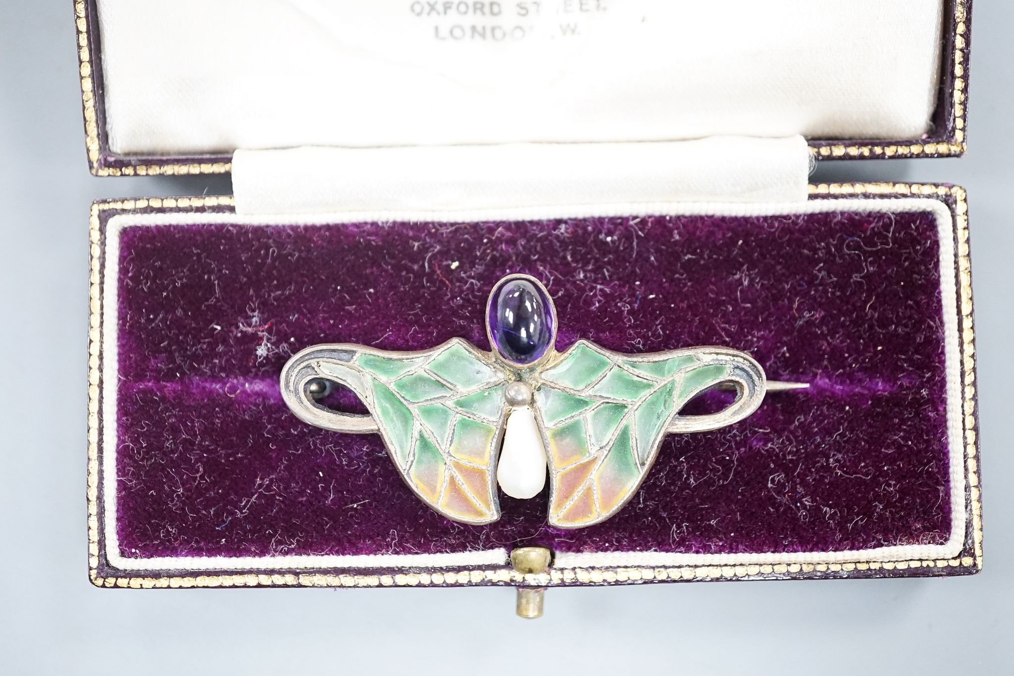 An Art Nouveau continental 900 standard gilt white metal, cabochon amethyst, baroque pearl and plique a jour set brooch, 45mm.